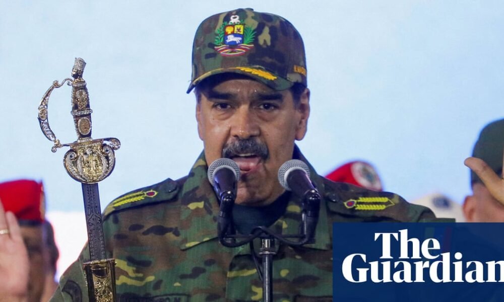 Nicolás Maduro holds Simon Bolivar's sword as he addresses a crowd during a rally against a possible escalation of US actions toward the country, at Fort Tiuna military base in Caracas in November. Photograph: Leonardo Fernández Viloria/Reuters