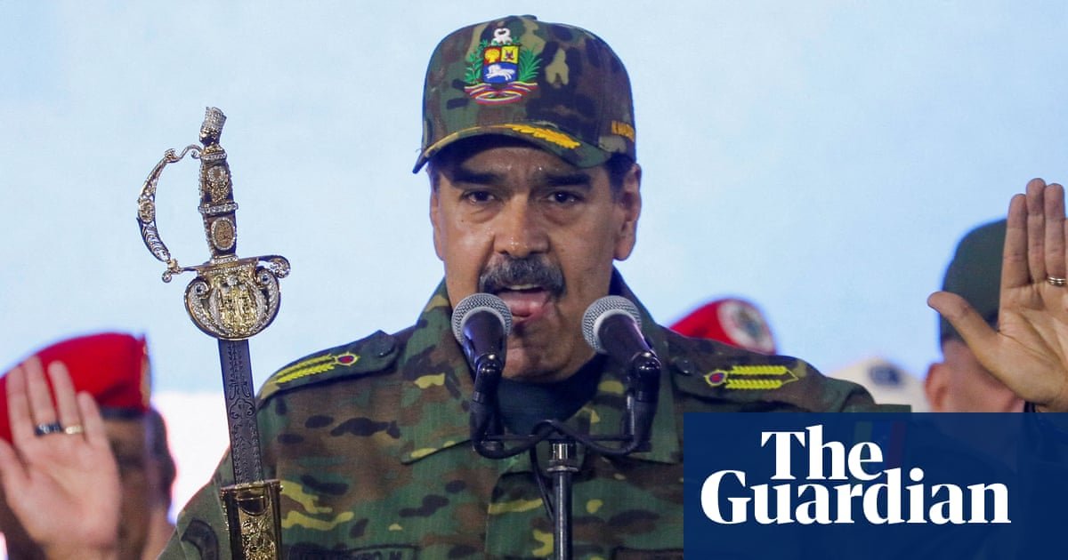 Nicolás Maduro holds Simon Bolivar's sword as he addresses a crowd during a rally against a possible escalation of US actions toward the country, at Fort Tiuna military base in Caracas in November. Photograph: Leonardo Fernández Viloria/Reuters