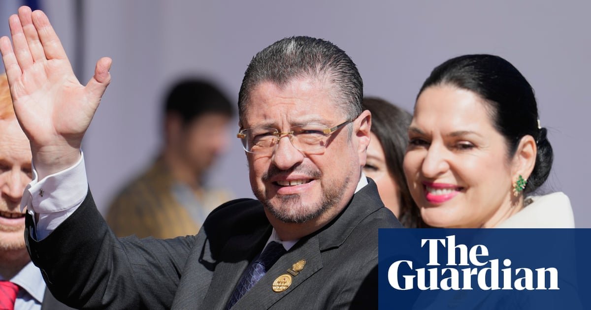 Costa Rica’s president, Rodrigo Chaves, with his wife, Signe Zeicate. Since taking office, Chaves has accused La Nación of being ‘political assassins’. Photograph: Gustavo Garello/AP