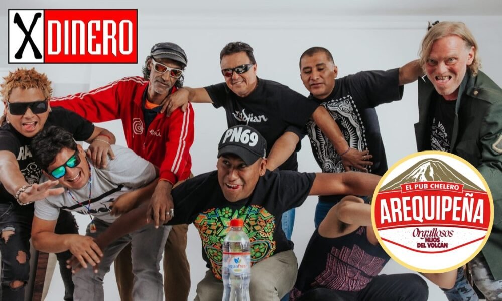 Nicky Jam — Un grupo de hombres posan sonrientes frente a un fondo blanco con logotipos y un anuncio publicitario. Foto de: El Búho