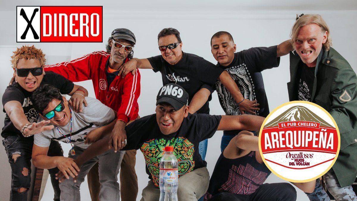 Nicky Jam — Un grupo de hombres posan sonrientes frente a un fondo blanco con logotipos y un anuncio publicitario. Foto de: El Búho