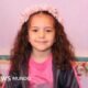 La niña Hind Rajab, cuya muerte en Gaza generó condena internacional, aparece sonriendo con una corona de flores. Foto de: Family/Reuters